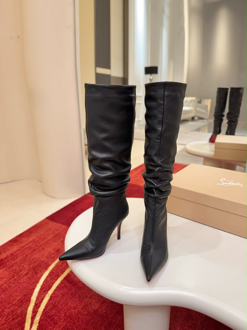 Iconic red-soled high-heeled boots