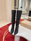 Iconic red-soled high-heeled boots