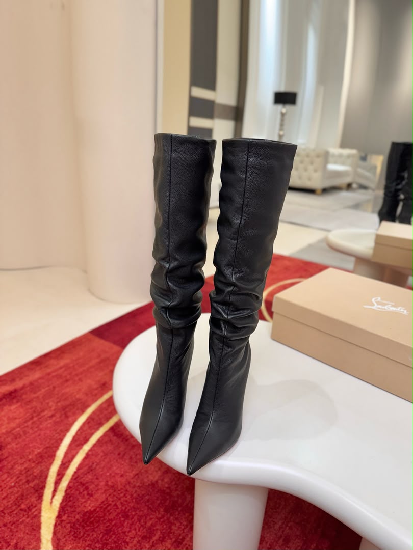 Iconic red-soled high-heeled boots