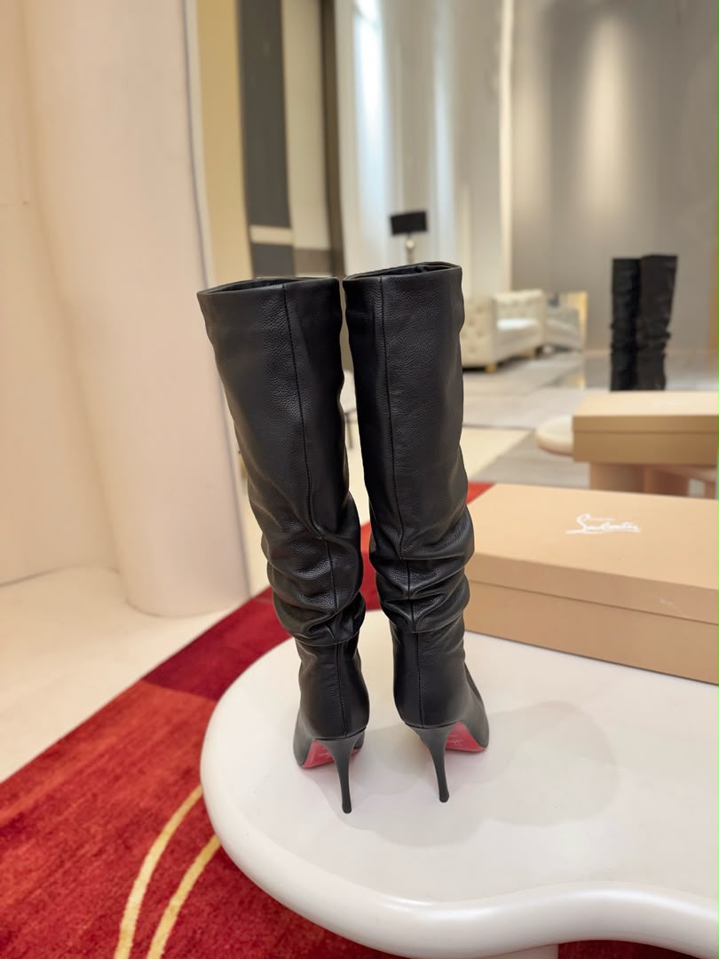 Iconic red-soled high-heeled boots