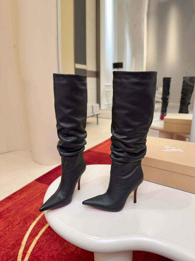 Iconic red-soled high-heeled boots