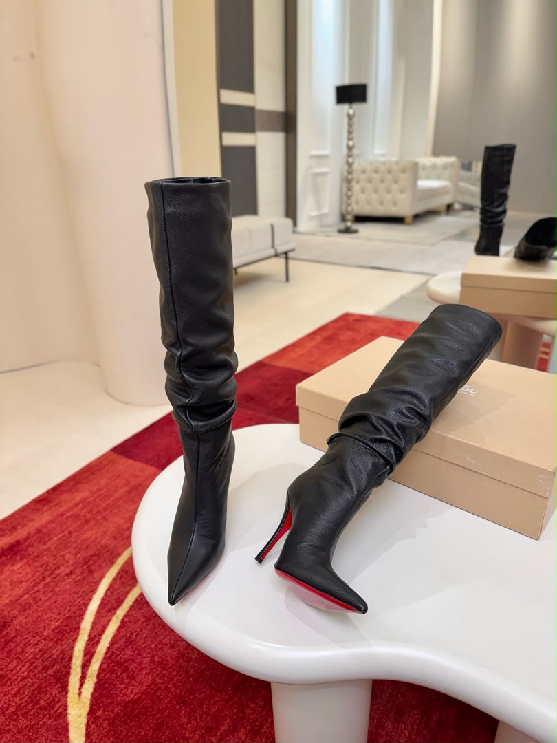 Iconic red-soled high-heeled boots